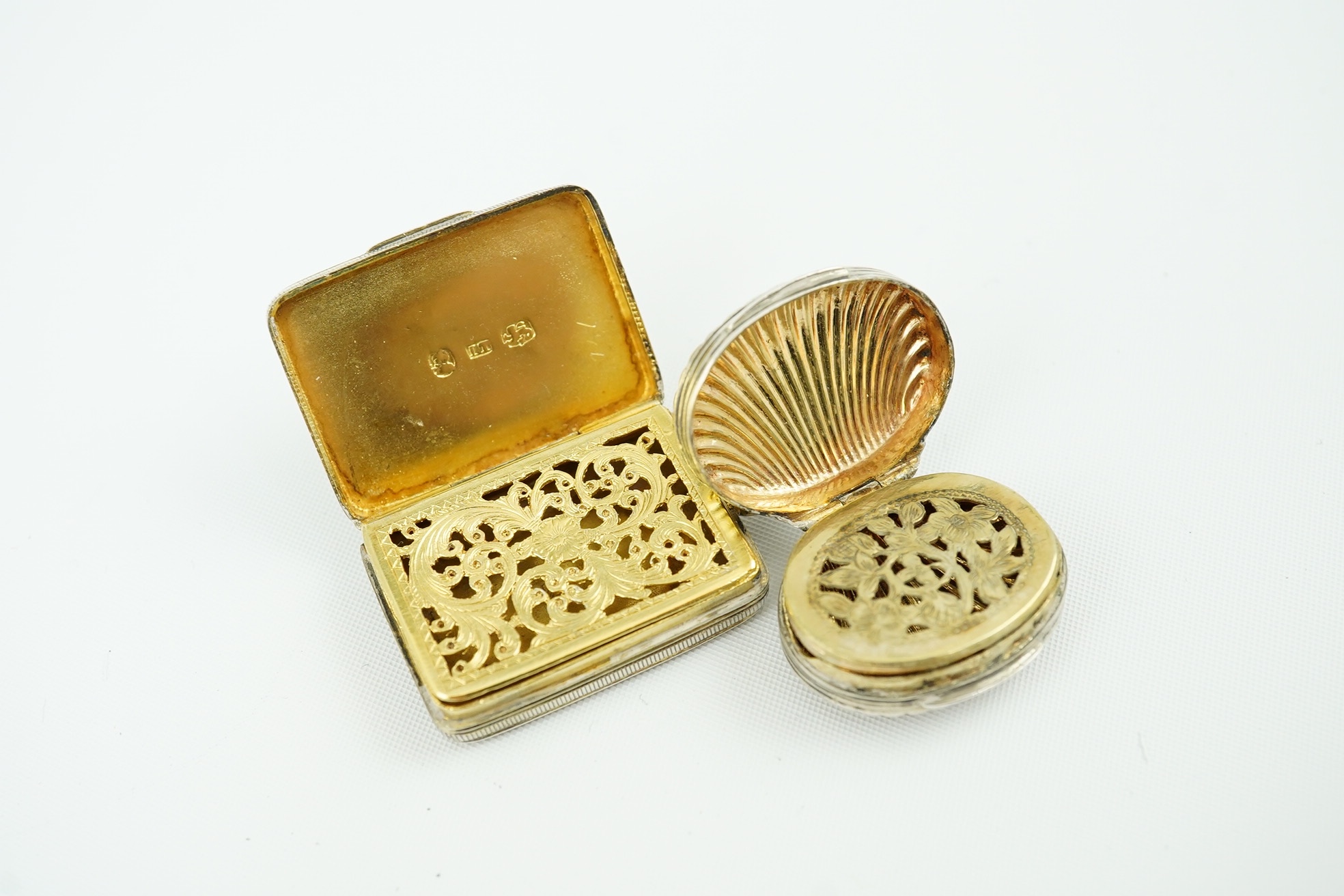 A late George III silver gilt vinaigrette by John Thropp, Birmingham, 1818, 30mm, together with a small shell shaped vinaigrette by Joseph Wilmore